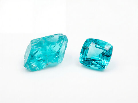 Natural rough paraiba tourmaline crystal beside polished cushion cut paraiba tourmaline gemstone, raw versus cut comparison isolated on white background, studio lighting. Generative AI