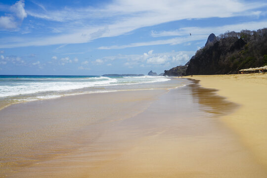 Deserted golden beach with a headland, Fernando de Noronha, Pernambuco, Brazil
