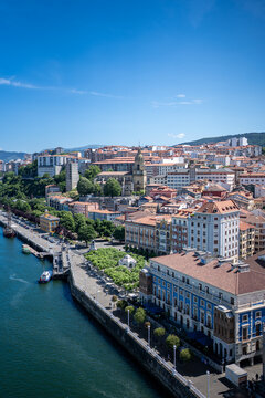 Bilbao city skyline along nervion river waterfront