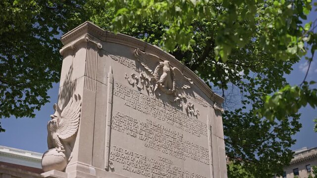 Rear view of the Robert Gould Shaw and 54th Regiment Memorial in Boston, Massachusetts. Cinematic shot highlighting the historic Civil War monument and detailed bronze sculpture in d