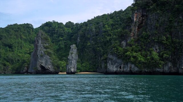 serene limestone cliffs observed against ocean and sky in travel nature landscape with blue and green hues and rock water materials, a peaceful natural setting.