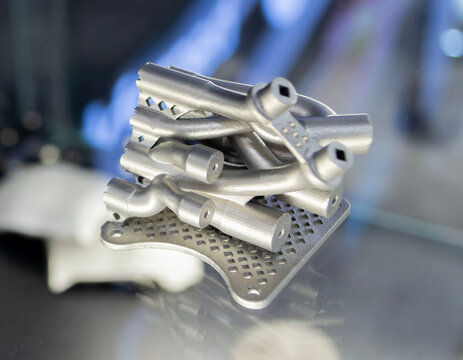 Object prototype hydraulic manifold printed on 3D printer. Model printed 3D printer from metal powder. Selective Laser Melting SLM. Additive new modern manufacturing. 3D printing technology Modeling