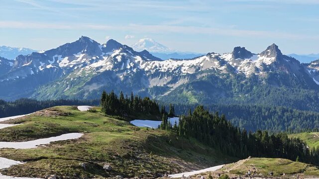 Snowy mountain peaks and green meadows in Washington state