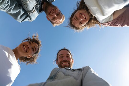 The Circle of Friends Enjoys Sunlit Sky Outdoors in Bright Daylight Together