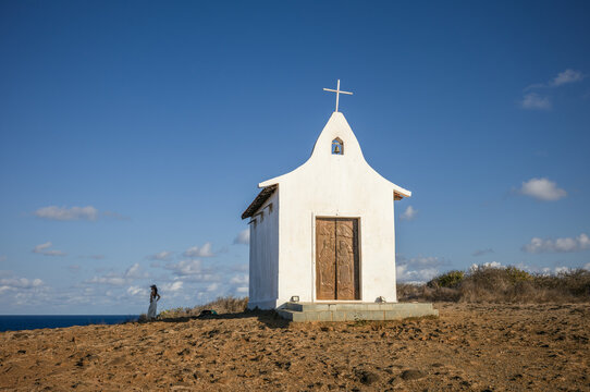 Small white chapel on a hill by the sea, Fernando de Noronha, Pernambuco, Brazil