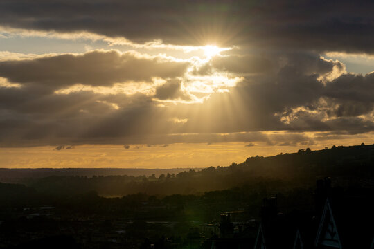 sunset over the mountains and Tyndall Effect