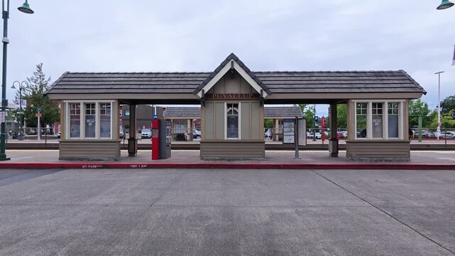 Empty rail station platform with waiting shelters