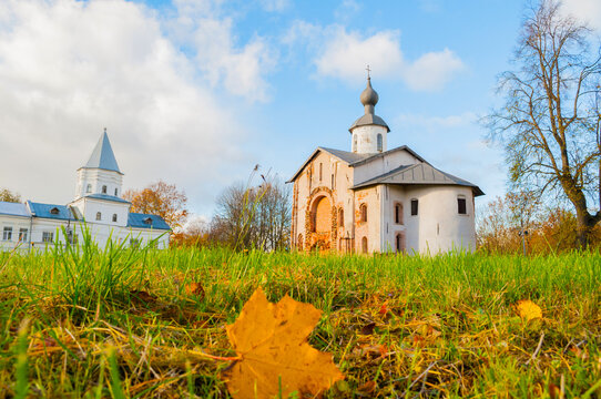 Autumn city landscape - Paraskeva Pyatnitsa Church and Gate tower at Yaroslav Courtyard in Veliky Novgorod, Russia, focus at the architecture