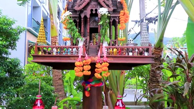 Thai spirit ghost house with offerings food and drink Thailand.