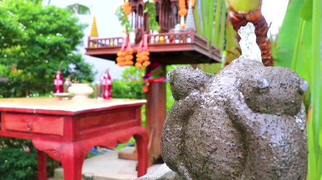 Thai spirit ghost house with offerings food and drink Thailand.