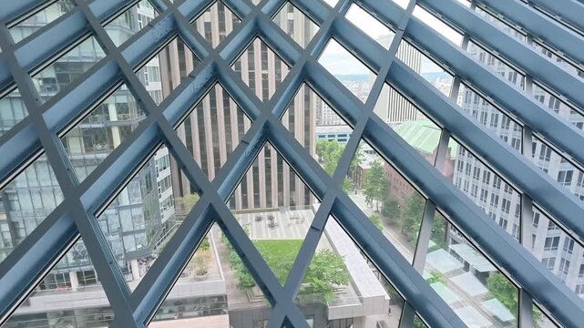 View of Seattle cityscape through blue steel lattice structure