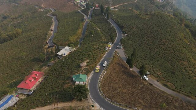 Drone view zigzag road in Mirik, North Bengal, India, at 4,905 feet. Stunning 4K aerial footage showcasing winding mountain roads, lush hills, and scenic Himalayan landscapes near Darjeeling.