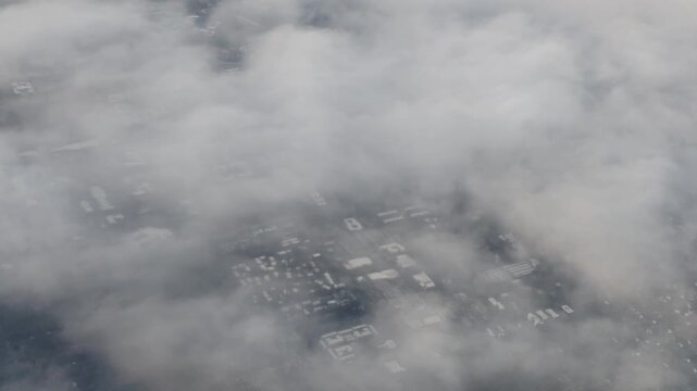 Aerial view of suburban landscape with clouds clearing