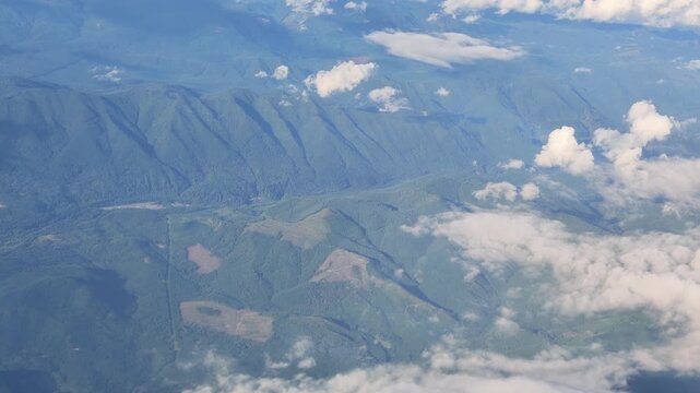 Aerial view of green mountains and clouds in Washington state