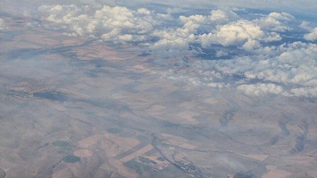 Aerial view of agricultural fields and clouds in Washington state