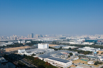 Fototapeta premium Industrial city district under blue sky