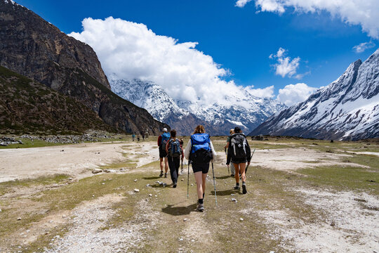 Travellers walking in the valley of Pungen Gumba in Manaslu Circuit Trek in Nepal 