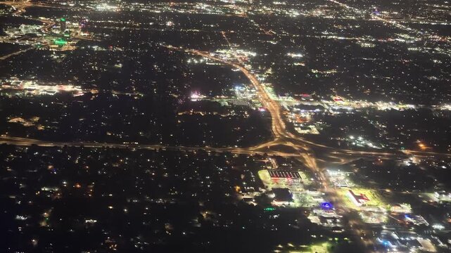 Aerial night view of Oklahoma City highway interchange and urban lights
