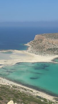 Vertical video panorama of Tigani cape and Balos lagoon with sandy beach.  Chania, Crete, Greece.
