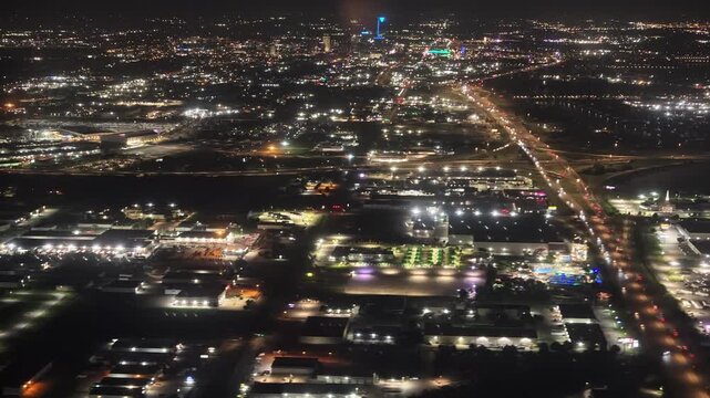 Aerial night view of Oklahoma City skyline and highway traffic