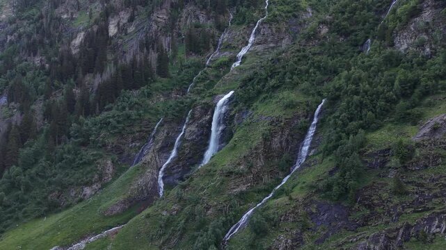 Mallnitz, Austria - June 11 2026: Spectacular 4K aerial drone footage of Schleierwasserfall, Seebachtal (Seebach Valley) in Hohe Tauern National Park, Austria. The video showcases breathtaking alpine 