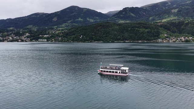 Millstatt, Austria - June 12 2026: Aerial Drone 4K Video of Boat Cruising on Millstatt Lake