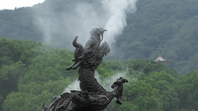 Dragons at Wuxi Lingshan Temple spitting out mist
