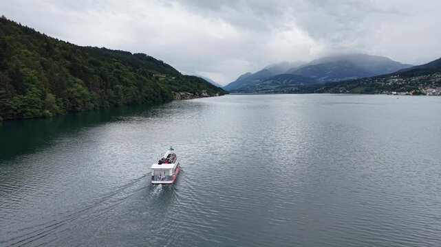 Millstatt, Austria - June 12 2026: Aerial Drone 4K Video of Boat Cruising on Millstatt Lake