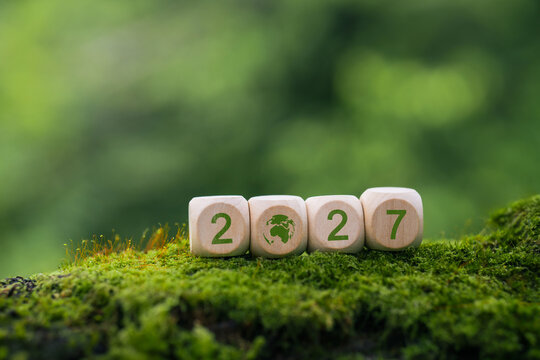 2027, New year Environment Concepts. Sustainable environment development goals, green business, clean planet and ecology, ESG and NetZero Concept. number on wooden cube.