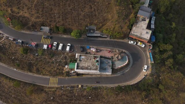 Drone view zigzag road in Mirik, North Bengal, India, at 4,905 feet. Stunning 4K aerial footage showcasing winding mountain roads, lush hills, and scenic Himalayan landscapes near Darjeeling.