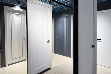 Contemporary white and grey panel interior doors displayed for sale indoors