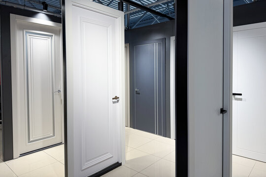 Contemporary white and grey panel interior doors displayed for sale indoors