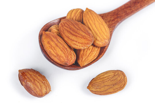 Fresh Peeled Almonds in Wooden Spoon - Healthy Natural Nuts Snack on White Background