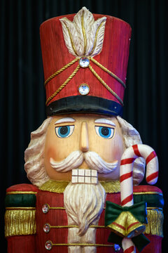 Decorative Nutcracker Figure with Candy Cane for Holiday Display - vertical
