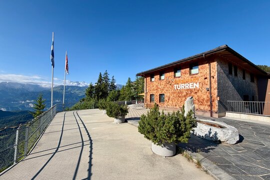 Turren, Switzerland - July 04, 2026: Summer view of the Turren mountain station and panoramic restaurant. Clear blue skies, alpine scenery and popular viewpoint overlooking the surrounding mountains.