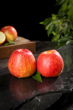 Fresh Red Apples Still Life with Water Droplets on Dark Slate Surface