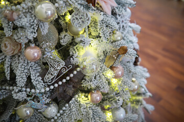 Fototapeta premium Festive Christmas Tree with Ornaments and Lights; Shiny Holiday Decorations; Seasonal Home Decor