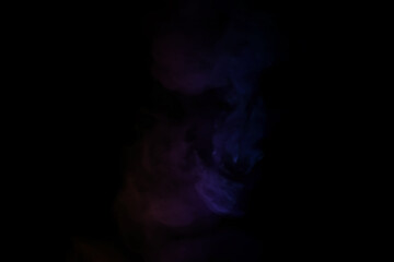 Fototapeta premium colorful smoke on dark background. Color steam on a black background. Red and blue smoke. Copy space.