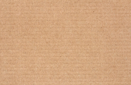 Cardboard sheet texture background, detail of recycle brown paper box pattern.