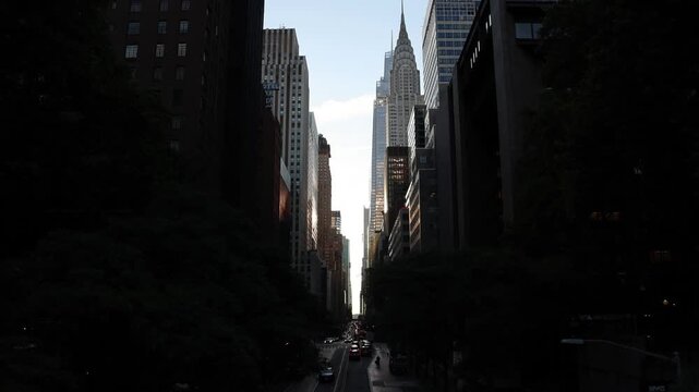 view down 42nd street in manhattan new york city skyline view (iconic skyscrapers) road cars drive sunset commercial business buildings center construction 2nd avenue travel tourism usa america famous