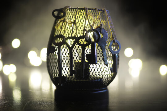 Vintage Keys in Wire Basket with Blurred Lights for Mystical and Antique Theme Stock Photography