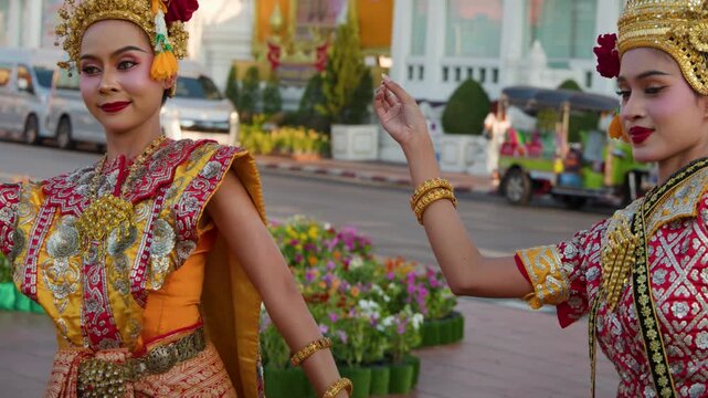 Thai Classical Dancers in Traditional Chut Thai Costume Performing Outdoors