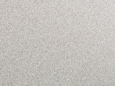 High-resolution macro photograph of a seamless, crisp gray and white speckled mineral stone composite pattern. This clean, non-directional textured surface is targeted for architectural rendering