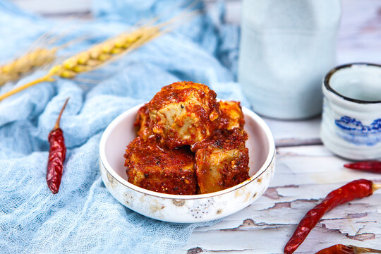 Chili Coated Fermented Tofu Cubes Paired With Chinese Tea And Dried Chilies