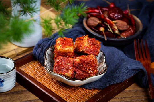 Chili Coated Fermented Tofu Cubes Paired With Chinese Tea And Dried Chilies