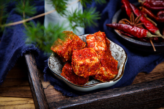 Chili Coated Fermented Tofu Cubes Paired With Chinese Tea And Dried Chilies