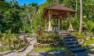 Ayung River and lush tropical hillside with traditional pavilion in Ubud, Bali, Indonesia © Balate Dorin