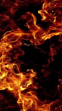 Intense fire flames on an empty black background, vertical photo featuring dramatic blazing fire, glowing embers and powerful heat effects
