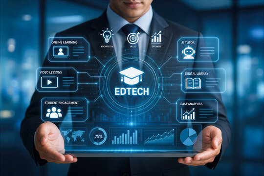 Business professional holding futuristic edtech hologram interface with digital icons data visualization online learning AI tutor digital library student engagement skills growth knowledge analytics