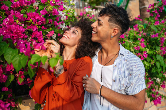 A multicultural couple promotes inclusion and equality while enjoying a peaceful day in nature